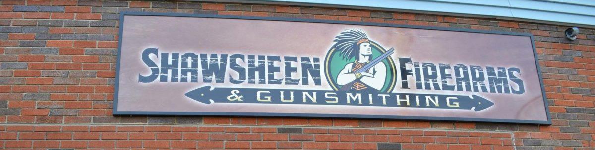 The storefront sign for Shawsheen Firearms & Gunsmithing in Billerica, MA